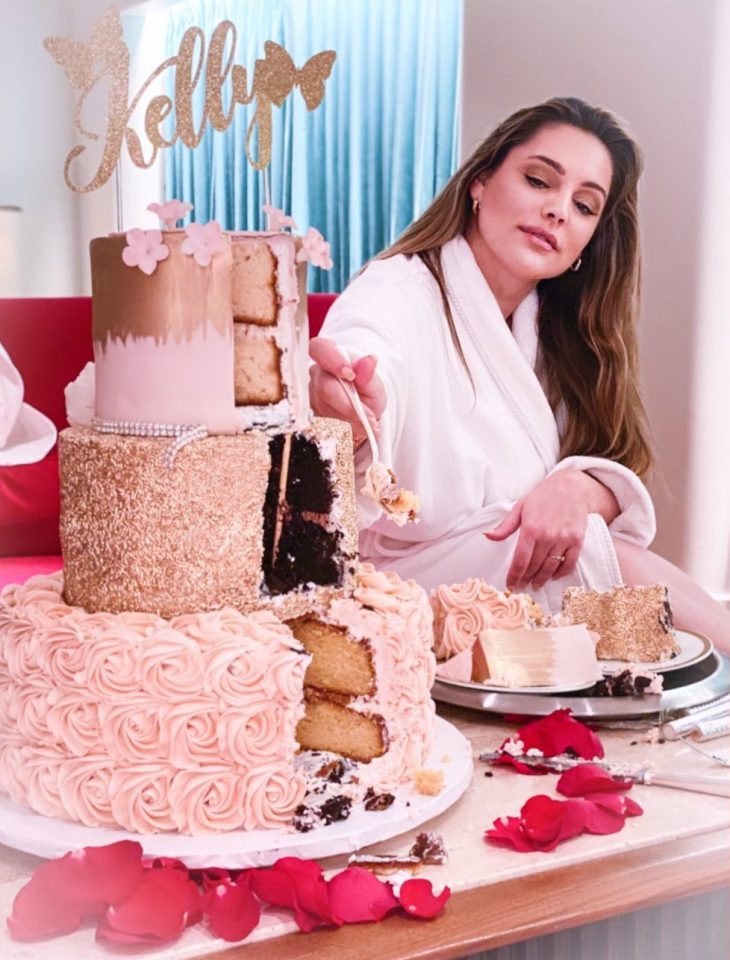  She shared a picture of her tucking into a towering pink cake