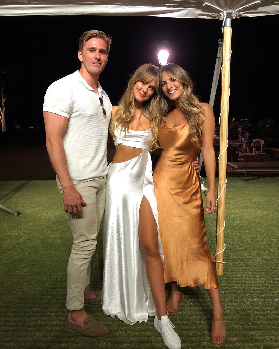 The fitness influencer and model changed into a skimpy silk gown and trainers for her reception