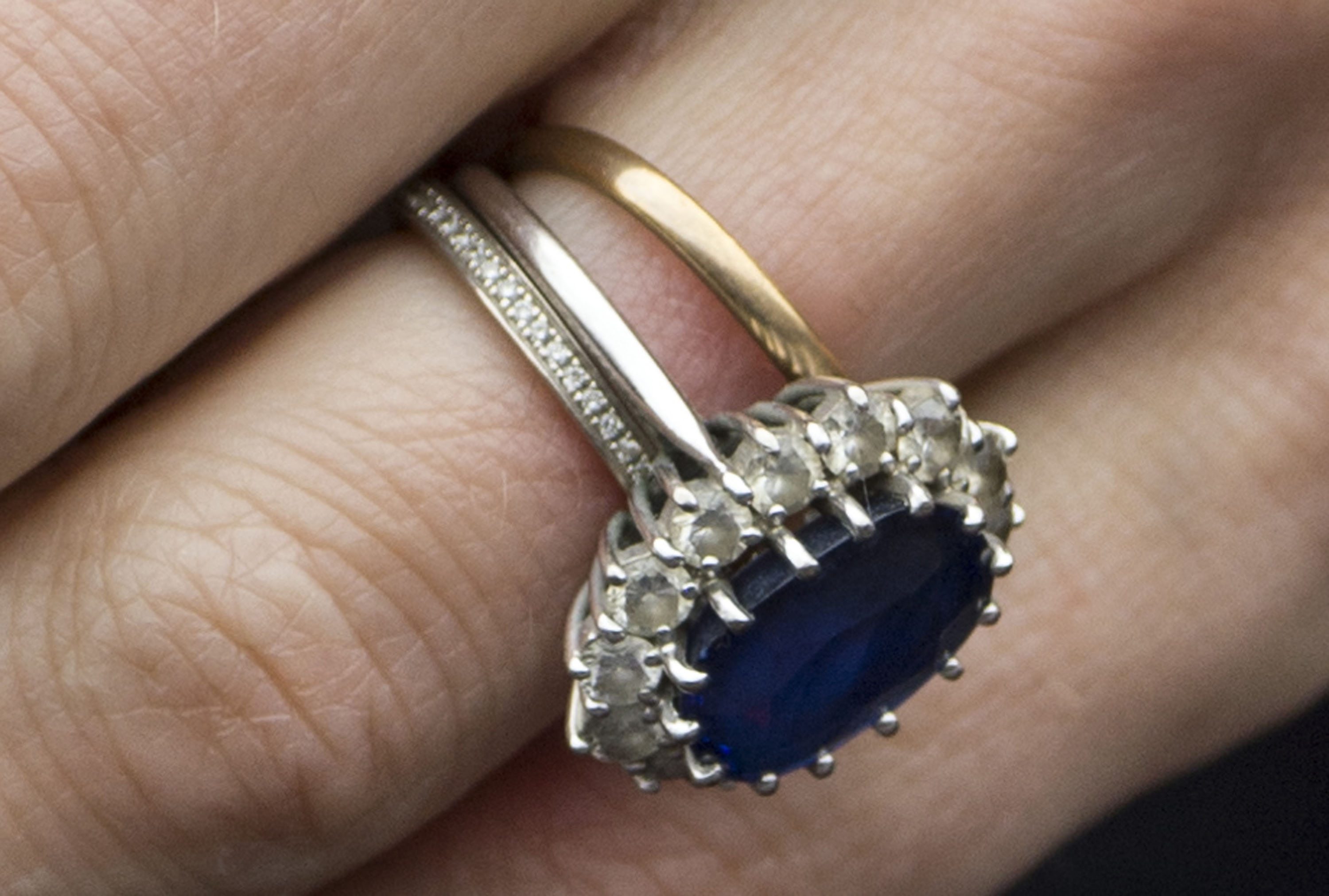 The delicate ring could be easily missed next to Kate's sapphire