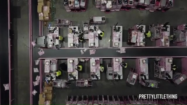  Workers sort through parcels in the warehouse