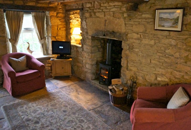  Stone walls and a wood burner are reminiscent of the film