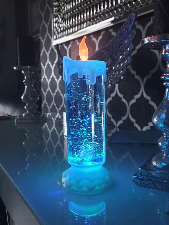 The candle flashes all different colours