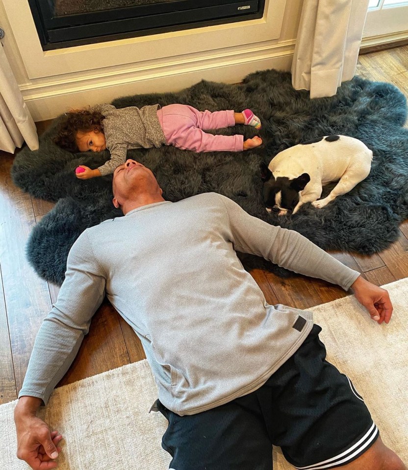  He shared an hilarious snap of his daughter lying on the floor with his dog Hobbs