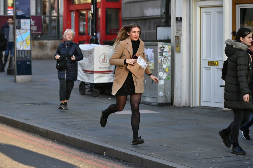 A woman can be seen running from the scene