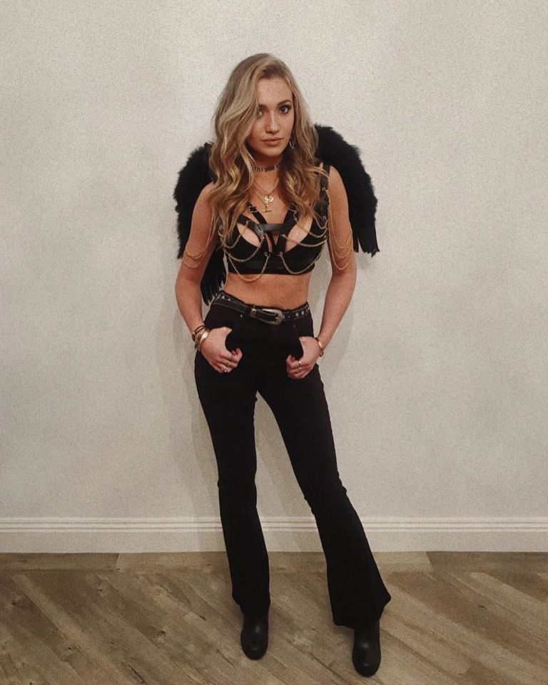  Tilly Keeper looked worlds away from her character in a sexy leather bralet for her Halloween costume this year