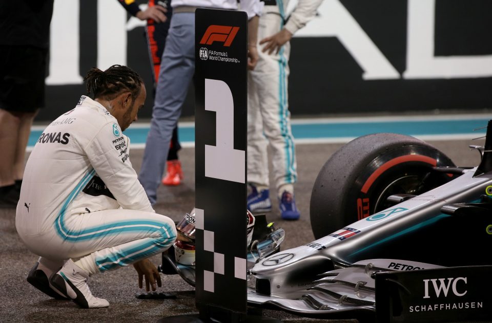  Hamilton celebrates his latest pole