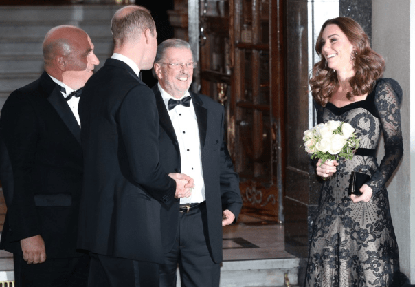  Kate holds a bouquet of flowers she was gifted on the night