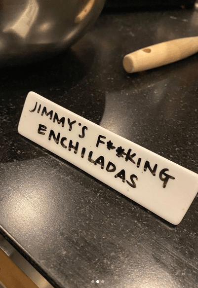  His place card hinted that she was miffed to have to make them