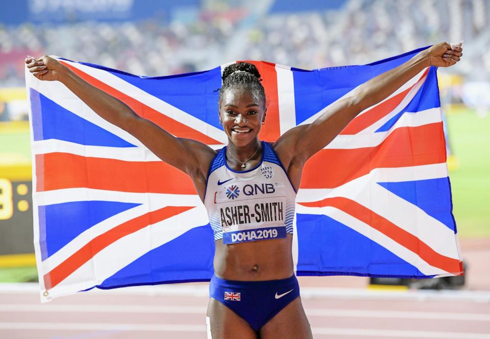  Dina Asher-Smith of Britain celebrates after winning the women's 200-meter race at the world athletics championships in Doha