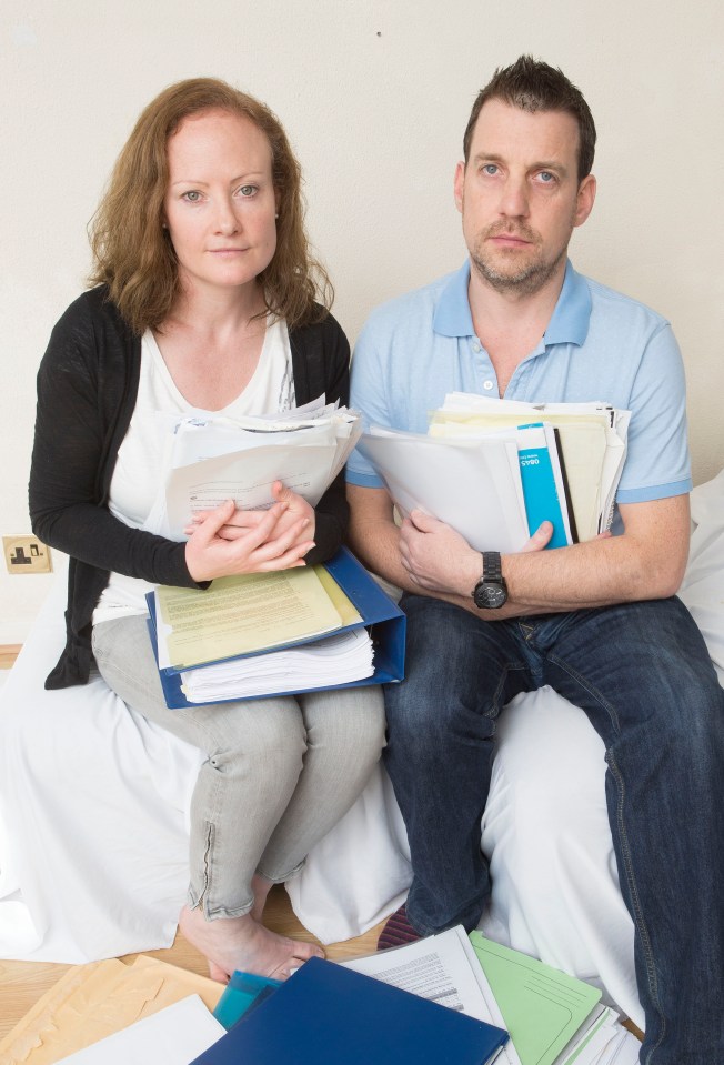  The couple holding just some of the paperwork they are downing in