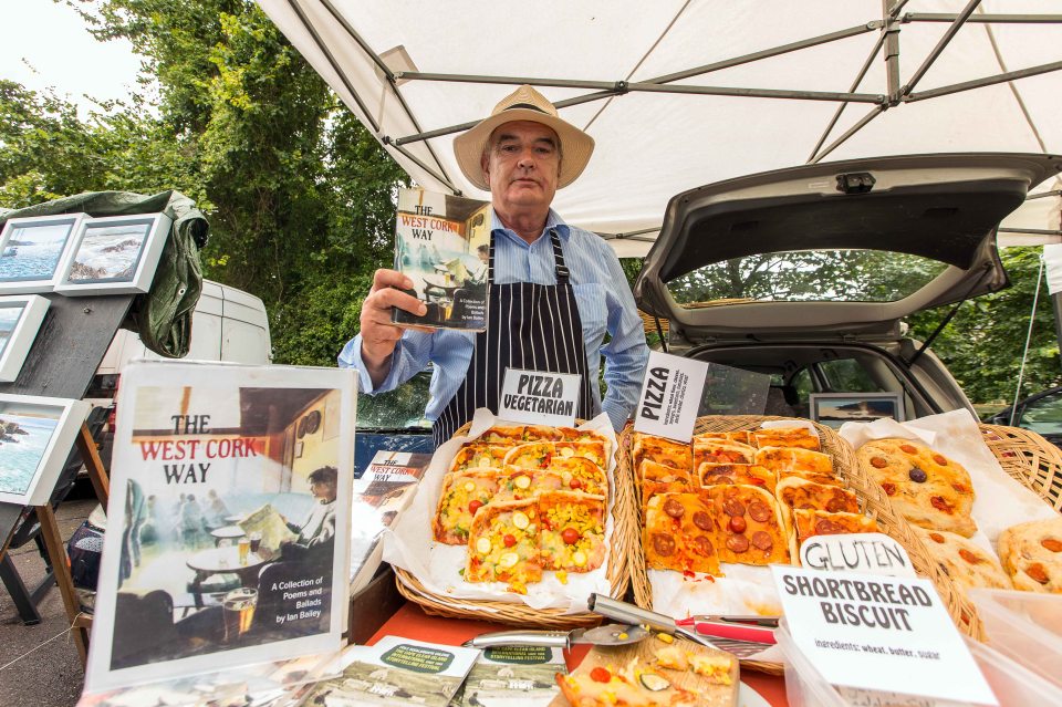  Manchester-born Bailey sells pizza and his books on a market stall