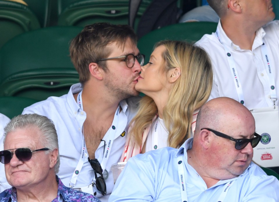  The pair kissing in the stands at the Wimbledon tennis tournament this summer