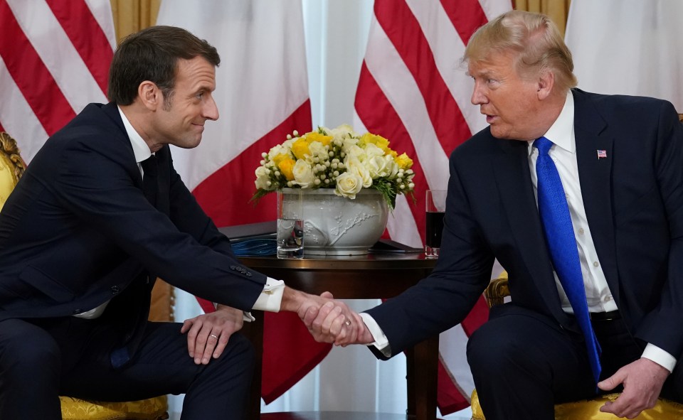  Hands-on: US President Donald Trump and France's President Emmanuel Macron shake hands in London