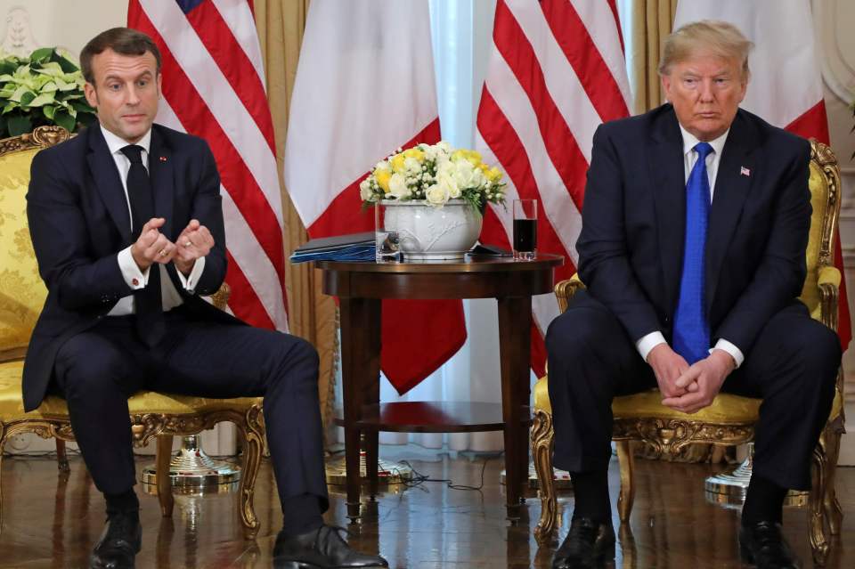  Trump looks less than impressed with his French counterpart