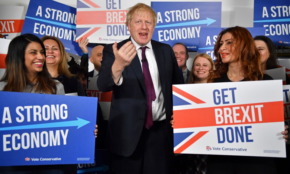  Boris Johnson surrounded by supporters at the Tories' campaign headquarters