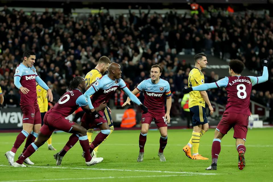  Angelo Ogbonna wheels away in celebration after scoring for West Ham