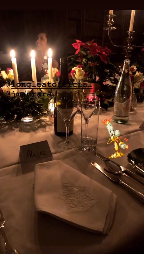  Christmas poinsettas and candles decorated the table