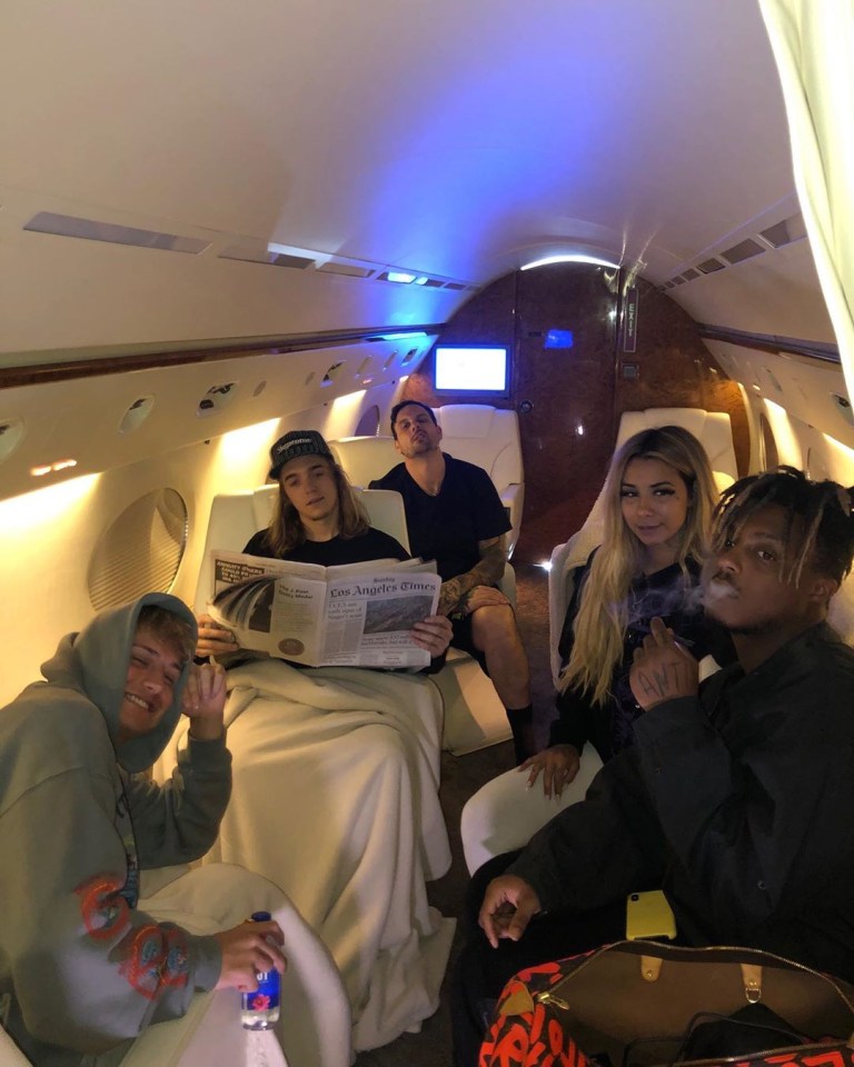 Juice Wrld and Ally Lotti, right, pictured with friends on a private jet