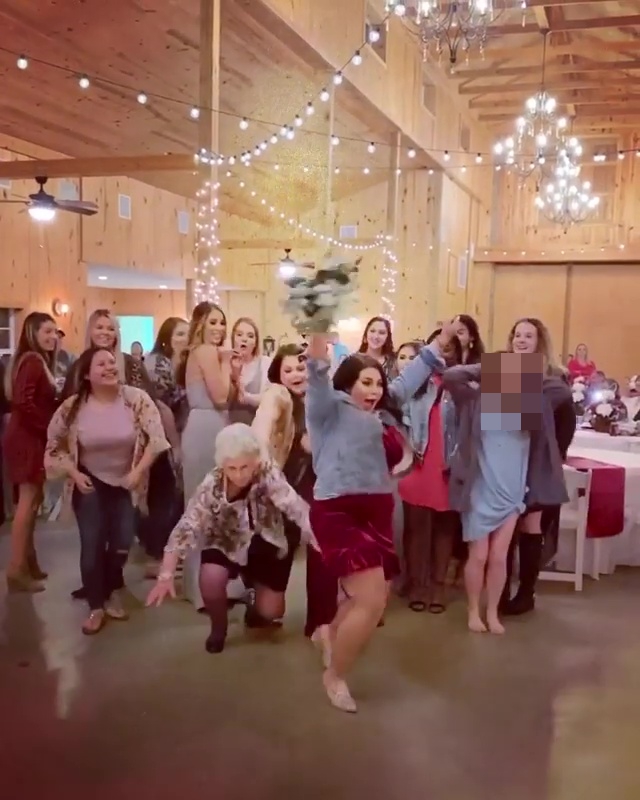  Several women rush to grab the bouquet