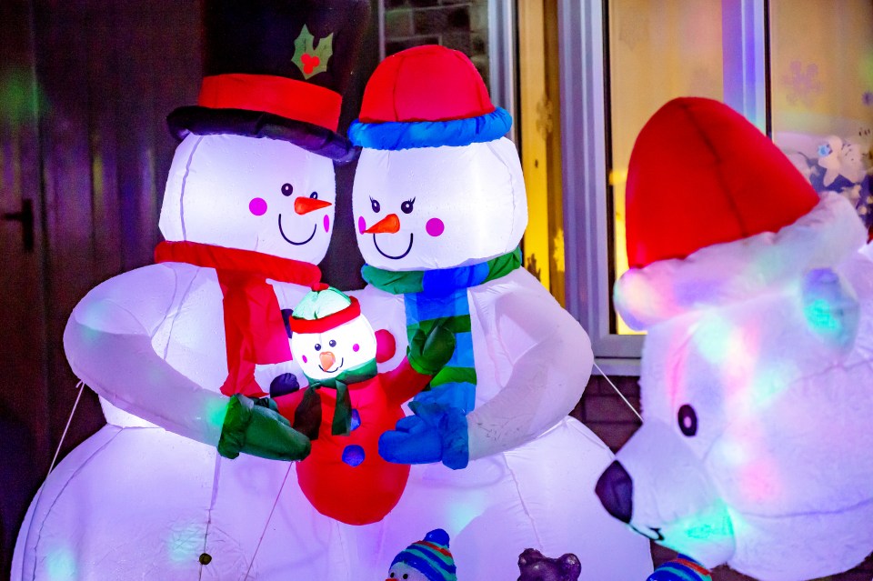  The snowman and his family are enjoying the light show, too