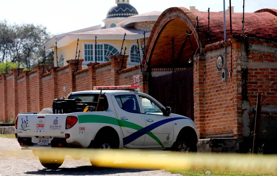  Cops at the scene of the mass grave