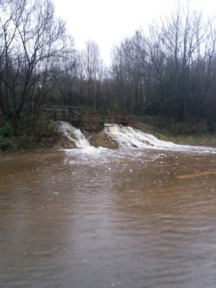  Water is gushing onto the M23 after heaving rains caused flooding