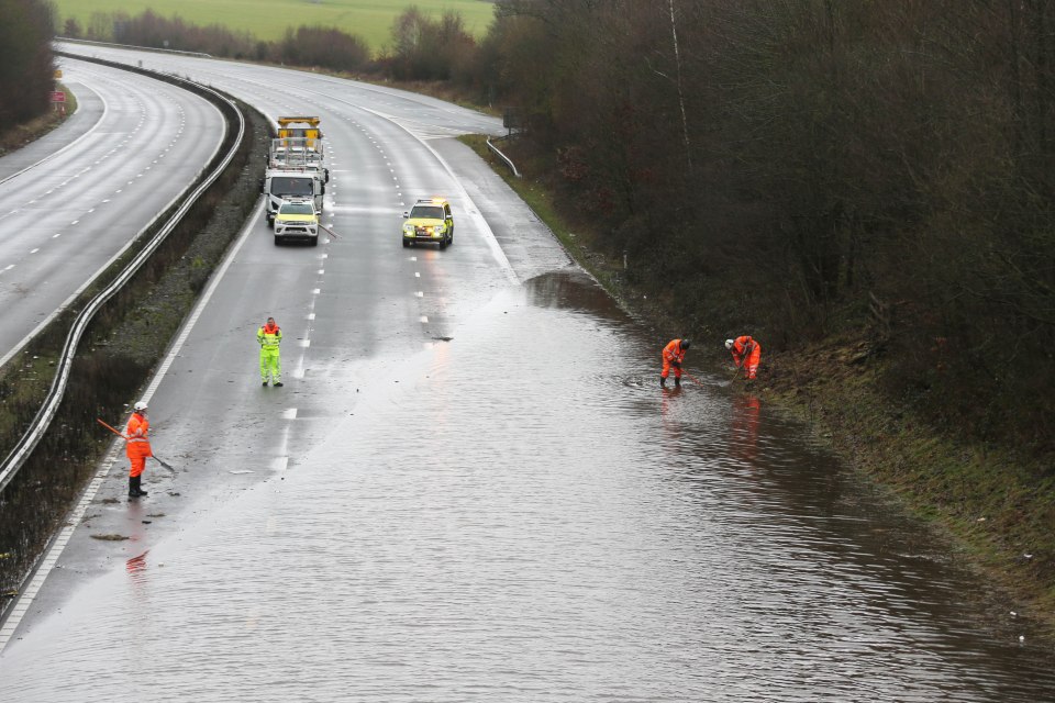  Work is ongoing to clear the M23 of floodwater this morning