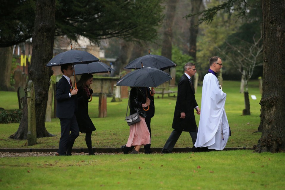  Mourners walk up to the church where Saskia's memorial service will take place