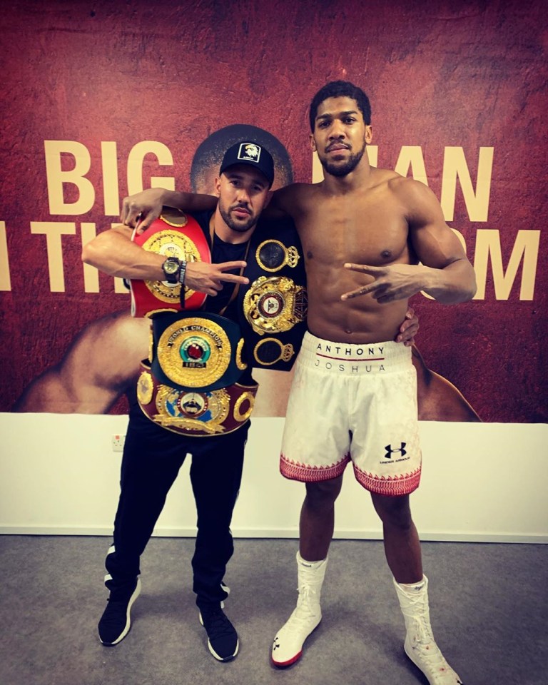 Anthony Joshua’s trainer Angel Fernandez, pictured with the champ here, doesn’t think Andy Ruiz Jr deserves the trilogf fight