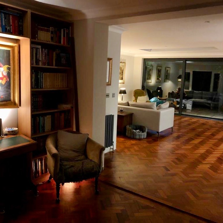  The property features a library and stunning parquet flooring