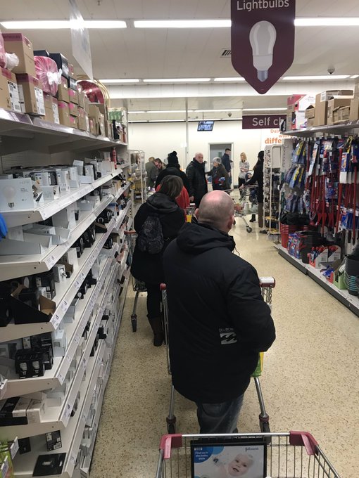  Shoppers are queuing around the aisles in some stores