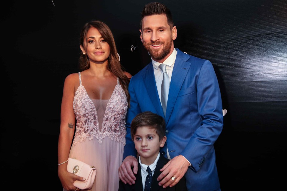  Messi poses with wife Antonella and eldest son Thiago