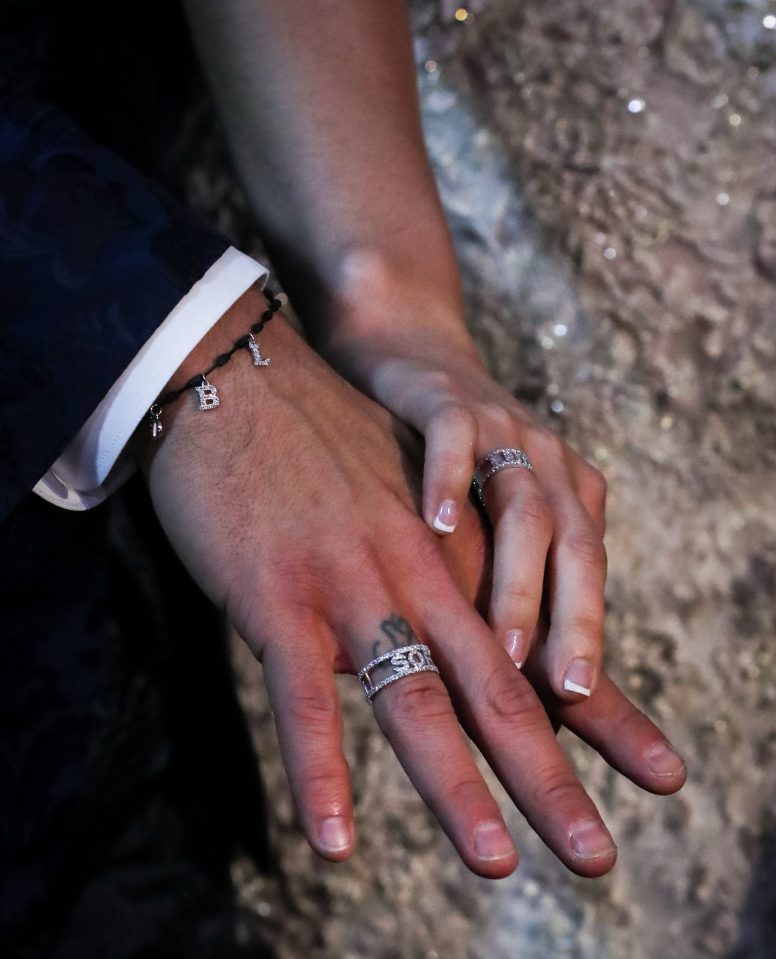  The couple showed off their rings, which appeared to have each other's names on