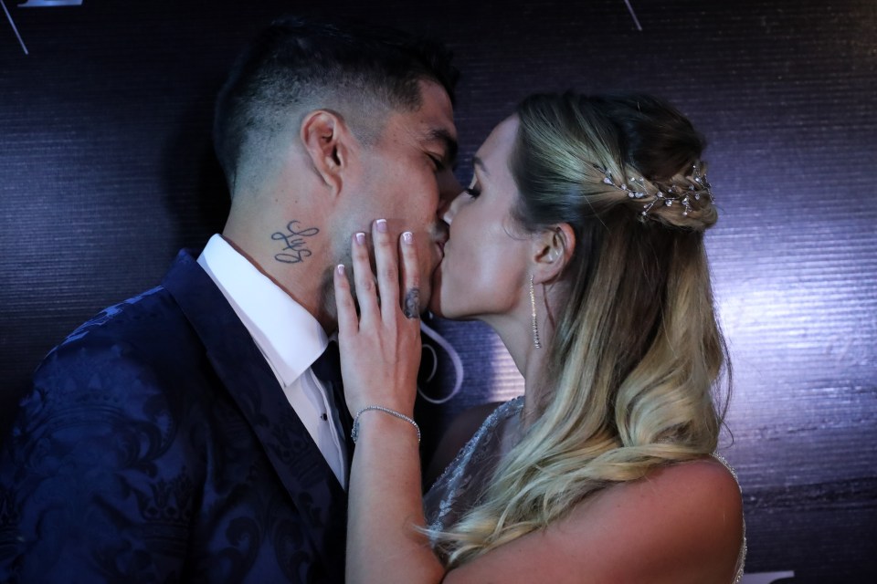  Luis Suarez and his wife Sofia share a huge kiss after renewing their vows