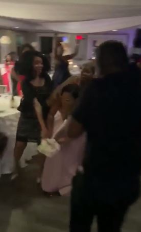 In a video shared on Reddit she can be seen tackling the guest after she caught the flowers