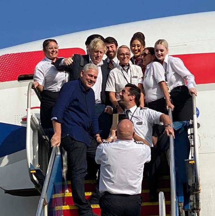  Boris Johnson poses with St Lucia PM Allen M. Chastanet and staff from British Airways during the brief layover on the Caribbean island