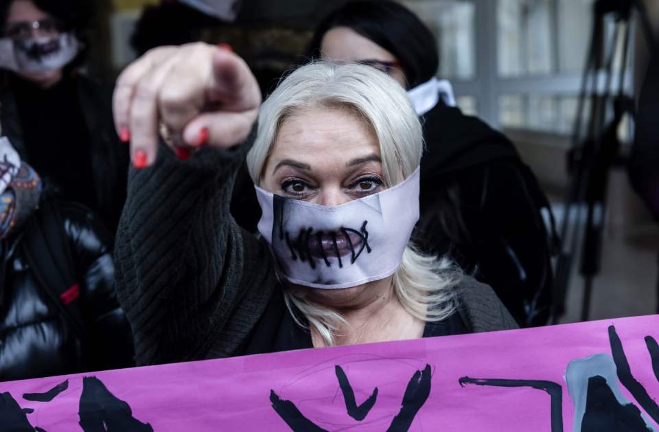 Women's rights activists also wore the 'stitched lips' masks