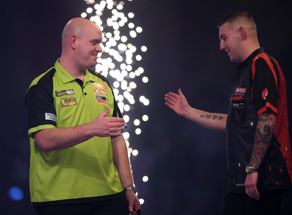  Van Gerwen shakes Aspinall's hand after last nights win