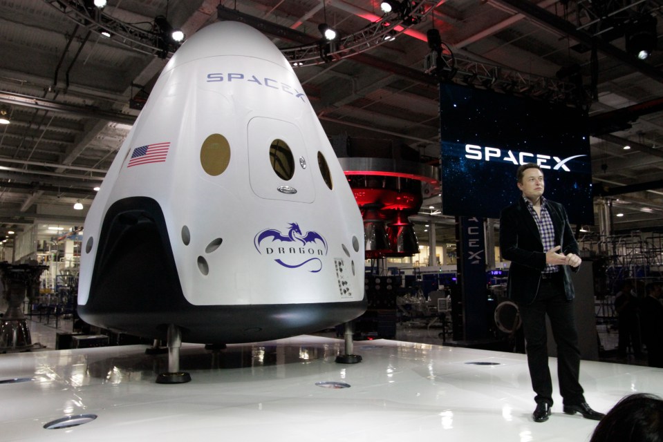  SpaceX boss Elon Musk stands with a Crew Dragon capsule