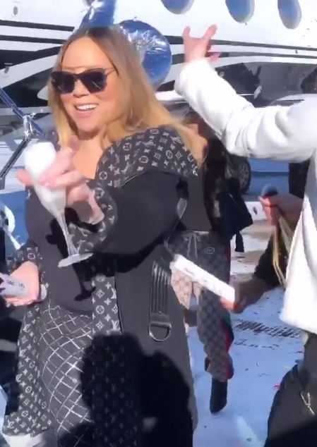  Mariah Carey raises a glass of fizz to the news 