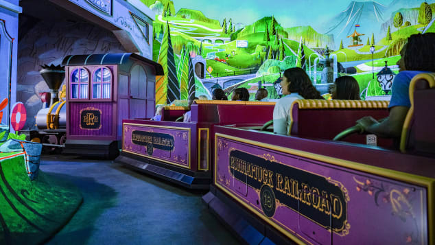 Guests are taken on a trackless cart through neon scenes and animations