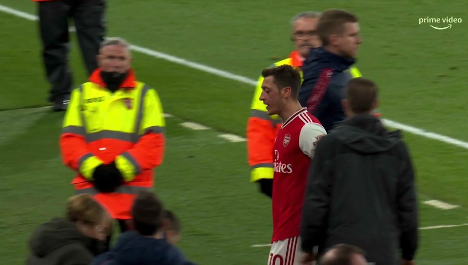  Ozil was still muttering to himself as he walked down the tunnel