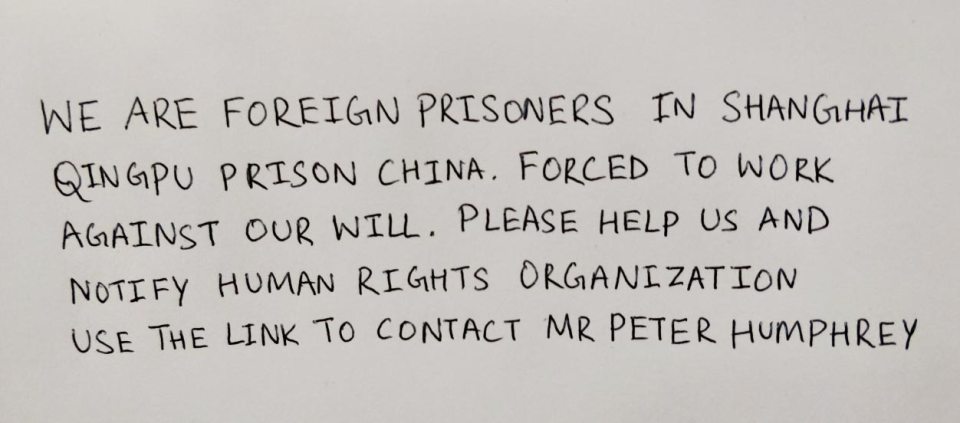 The note in A Tesco Christmas card from a desperate prisoner in Shanghai - his handwriting changed to protect his identity