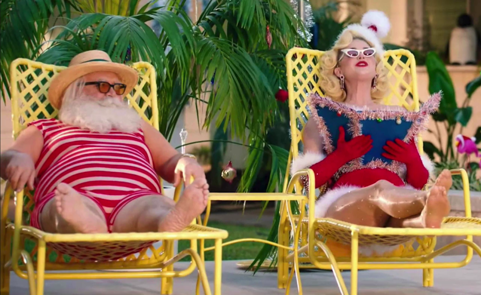  Katy and Father Christmas sit by the pool like a pair of Love Island contestants