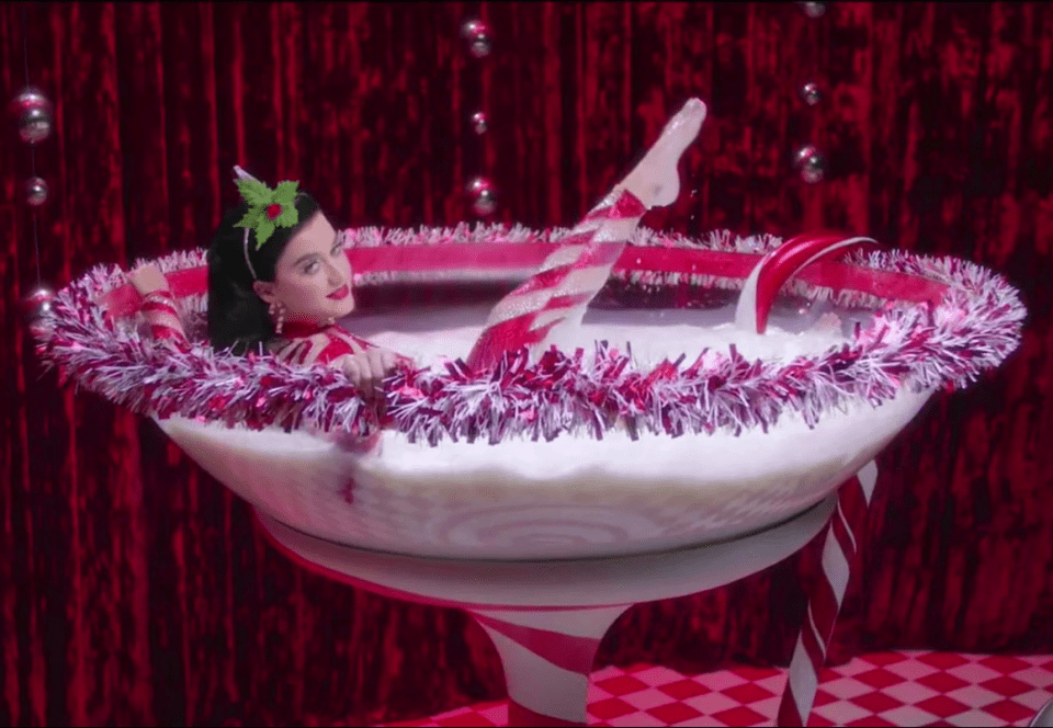  Katy splashes around in a giant glass like Dita Von Teese