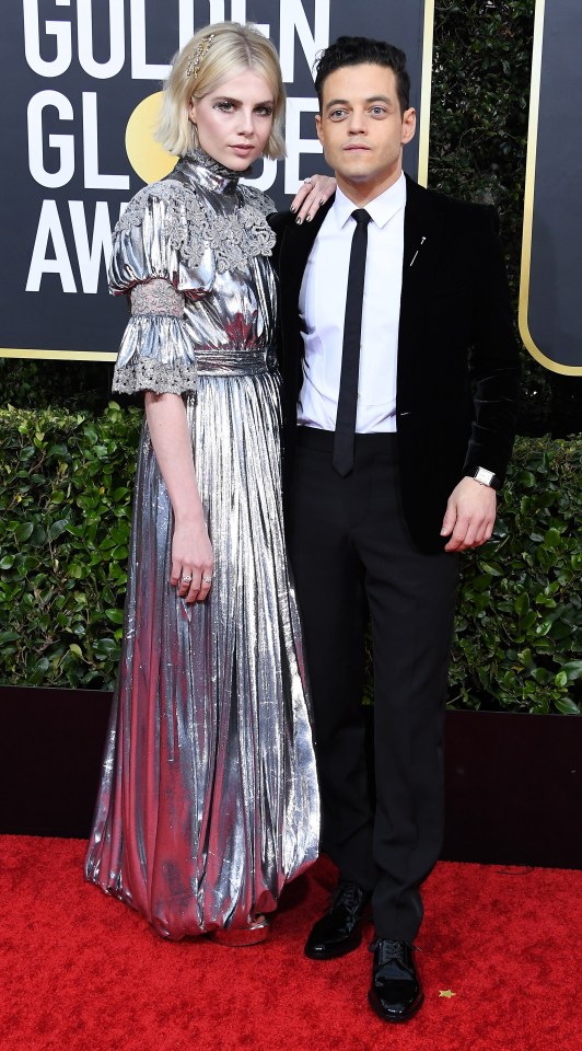 A-List couple Lucy Boynton and Rami Malek looked effortlessly cool on the red carpet as Lucy showed off her statement silver dress