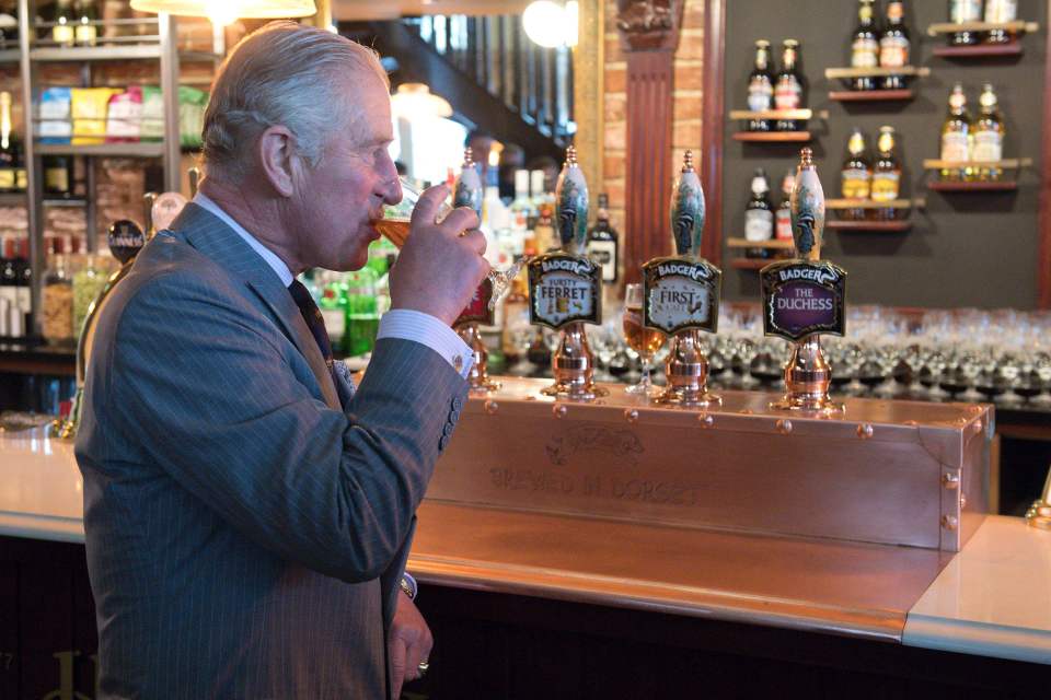  Charles drinks a half pint of The Duchess ale inside the Duchess of Cornwall pub in Poundbury