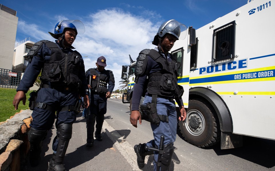  Heavily-armed police pictured during an operation in Cape Town