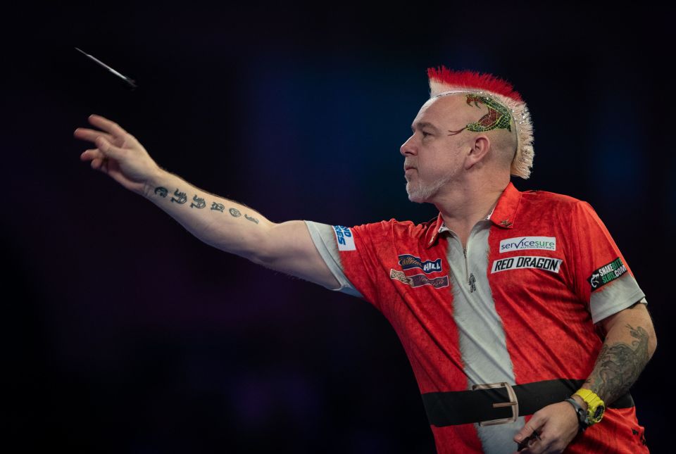  Peter Wright got into the festive spirit with a red and white hairstyle