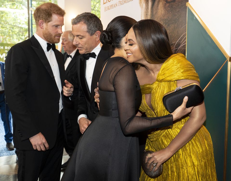 Meghan Markle and Beyonce hug at the Disney Lion King premiere - with reports the couples had hoped to go on holiday together